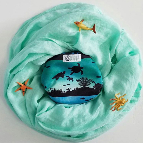 Nicki's Diapers bamboo blanket in key lime and cloth diaper in Underwater World