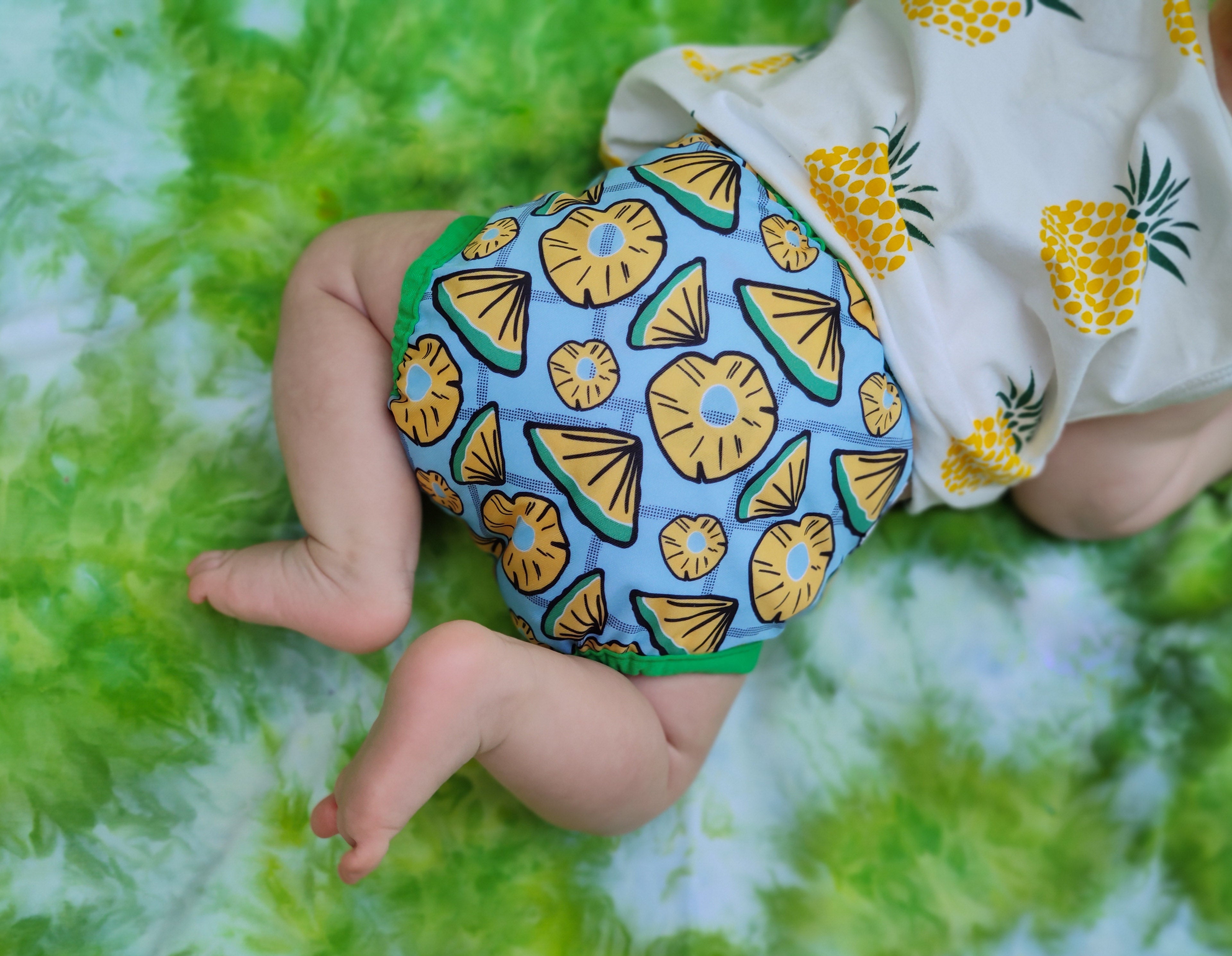 Baby wearing an Imagine Baby All in One Diaper